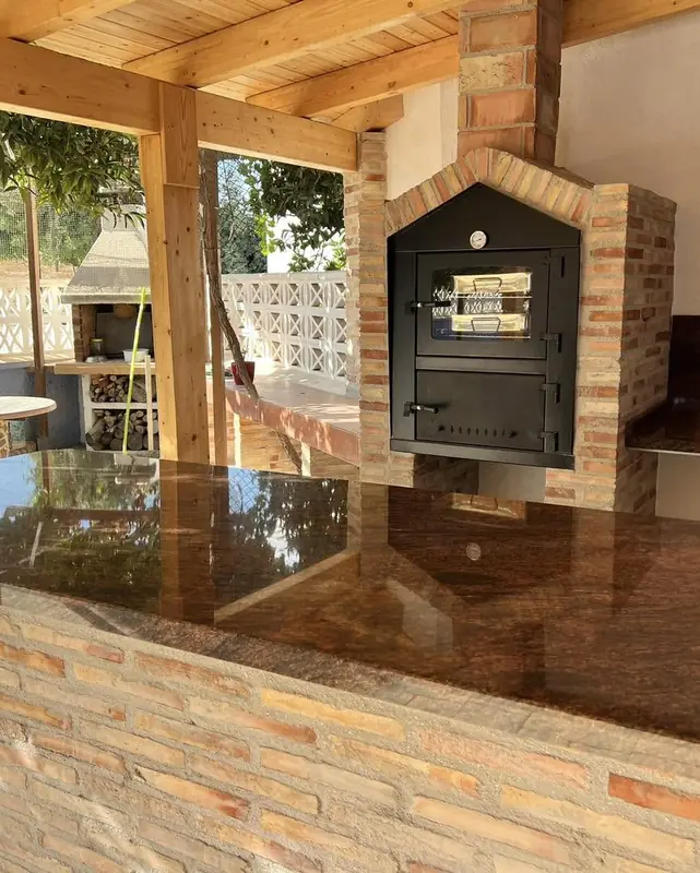 Cocina exterior con horno de leña - después